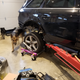 One of Chuck’s helpers on this build helps remove the A4's rear axle assembly.